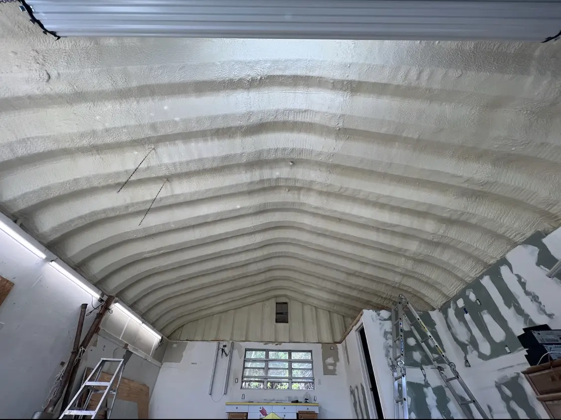 Spray polyurethane foam applied to the underside of a metal roof deck in Lewistown